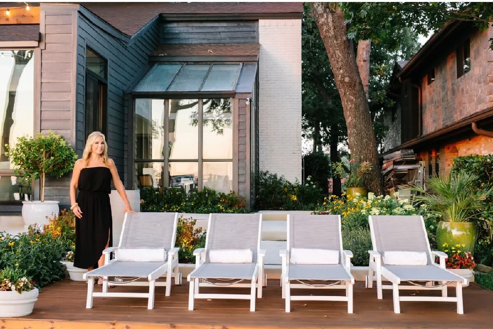 Contemporary pool deck with Coastal chaise lounges creating a sophisticated resort-inspired relation area.